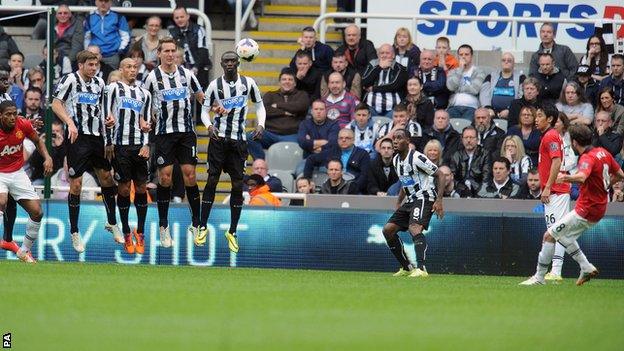 Juan Mata (right) curls in a free-kick to give Manchester United the lead at Newcastle