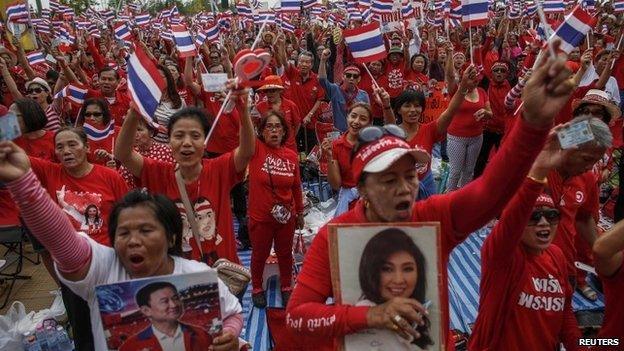 Members of the pro-government "red shirt" group take part in a rally on the outskirts of Bangkok, on 5 April 2014.