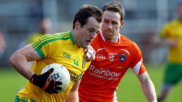 Michael Murphy tries to get around Finian Moriarty at the Athletic Grounds