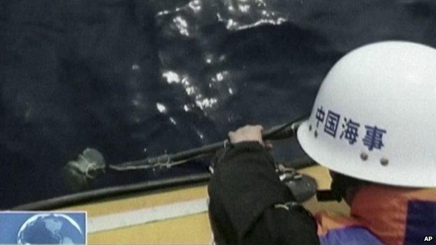 Footage from China's CCTV channel show Chinese search team using an instrument to detect electronic pulses while searching for the missing Malaysia Airlines Flight 370 on 5 April, 2014