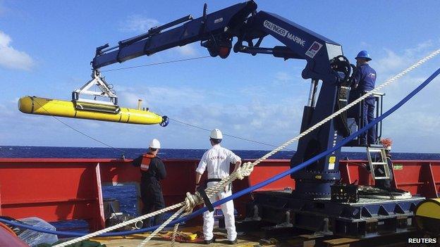 The Bluefin 21 is hoisted back on board the Australian Defence Vessel Ocean Shield after a successful buoyancy test in the southern Indian Ocean as part of the continuing search for the missing Malaysian Airlines flight MH370, in this picture released by the Australian Defence Force on 4 April 2014