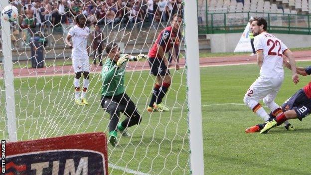 Mattia Destro (right) of Roma scores the opening goal