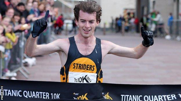 Paul Pollock celebrates at the finish line