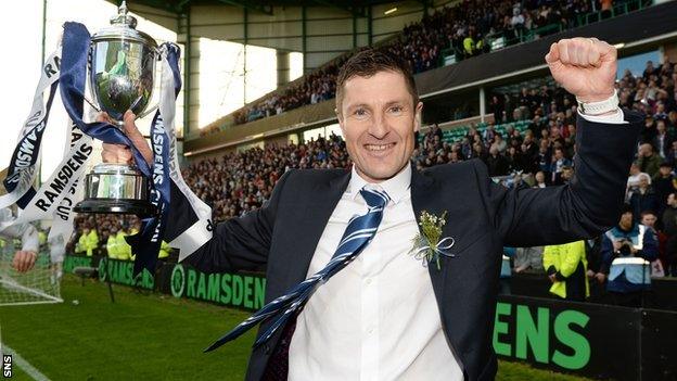 Grant Murray with the Ramsdens Cup after Raither Rovers beat Rangers 1-0