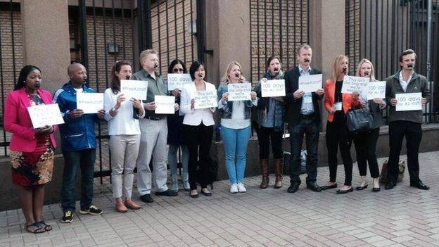 Journalists with their mouths taped outside Oscar Pistorius trial in Pretoria (07/04/14)