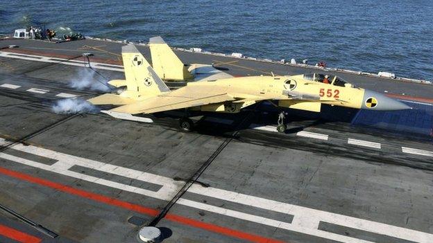 A J-15 fighter jet lands on the Liaoning aircraft carrier