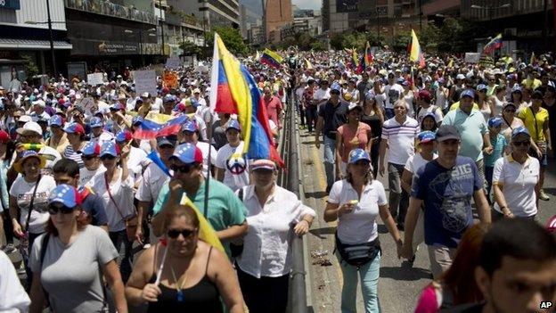 Anti-government demonstrators march in Caracas on 2 March, 2014