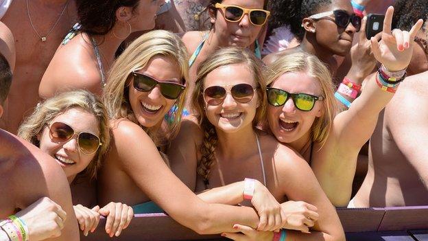 College students celebrate on the beach in Cancun, Mexico during spring break on 20 March, 2014.