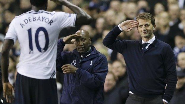 Tottenham's Emmanuel Adebayor, left, salutes to manager Tim Sherwood (right)