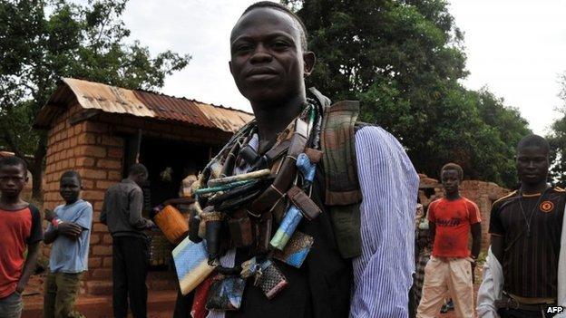 An anti-Balaka militiaman, wearing several charm necklaces, in CAR on 5 March 2014