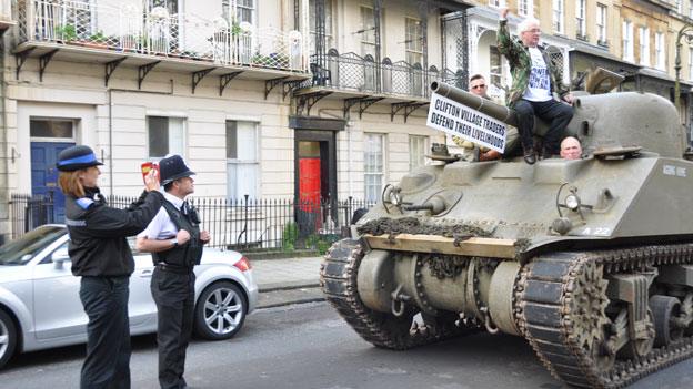 A PCSO taking a photograph of the tank