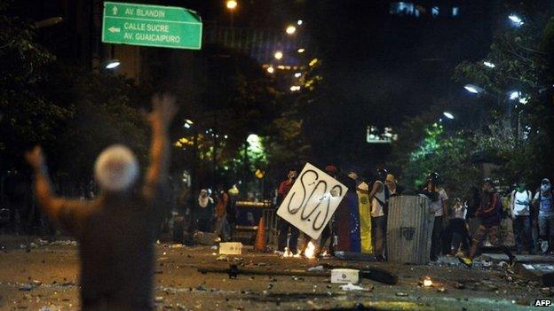 Anti-government protestors are seen during clashes with members of the National Guard in Caracas on 29 March, 2014