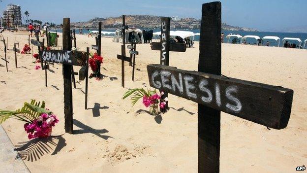 Several crosses are placed on the beach in protest for students killed during demonstrations in Puerto la Cruz on 1 March, 2014