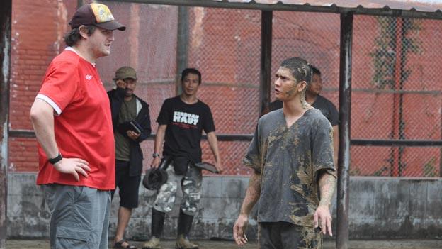 Gareth Evans and Iko Uwais on the set of The Raid 2