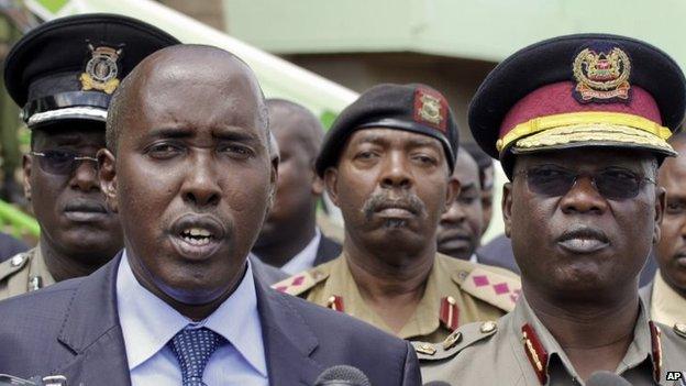 Joseph Ole Lenku (L) with police officials