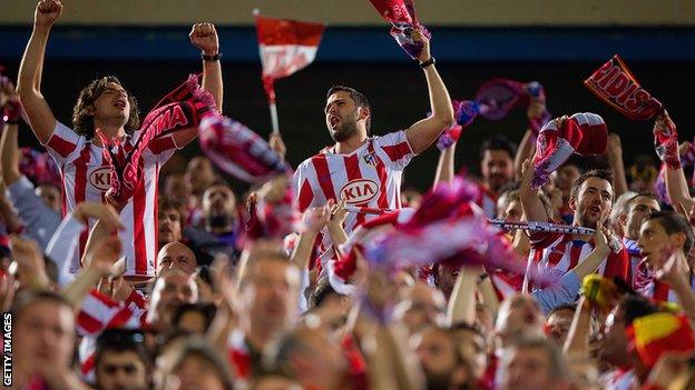 Atletico Madrid fans at the Vicente Calderon stadium celebrating their win over Barcelona in the Champions League