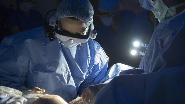 Surgeon wearing goggles during operation