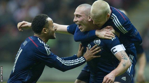 Scotland captain Scott Brown celebrates his winner against Poland