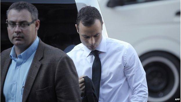 South African track star Oscar Pistorius arrives for his trial at the North Gauteng High Court in Pretoria on 11 April