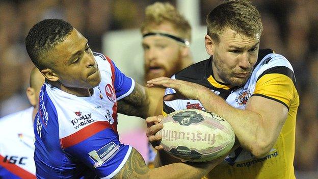 St Helens' Jordan Turner and Castleford's double try scorer Michael Shenton tussle for possession