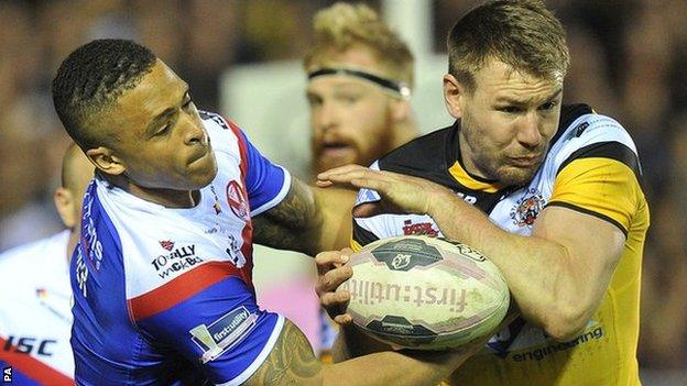 St Helens' Jordan Turner and Castleford's double try scorer Michael Shenton tussle for possession