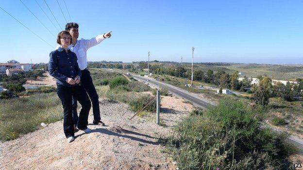 Ed Miliband and his wife Justine looking out from the top of a hill in Israel