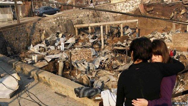 Residents survey the damage in Valparaiso, April 13, 2014.