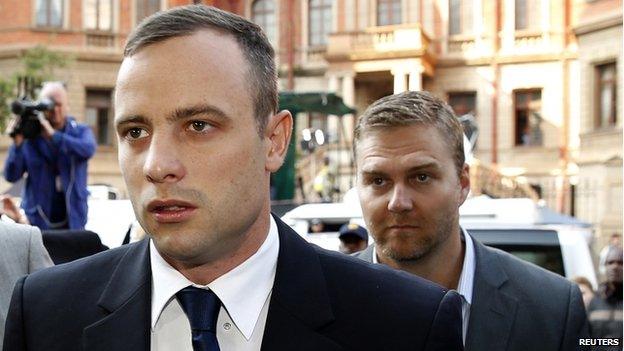 Oscar Pistorius (left) arrives ahead of his trial at North Gauteng High Court in Pretoria, 15 April 2014