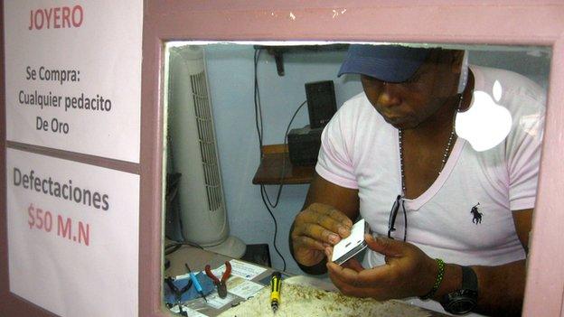 Woman in a smartphone repair shop