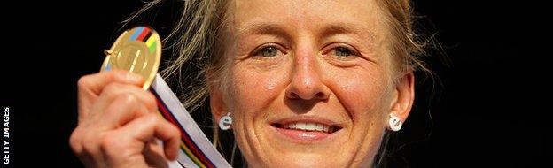 Emma Pooley of Great Britain poses with her medal on the podium after winning the Women's Elite Time Trial on day one of the UCI Road World Championships.