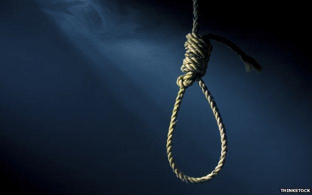 A noose on a dark background