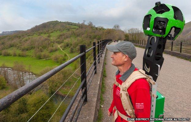 Peak District National Park Ranger with Google Trekker backpack on the Monsal Viaduct, Peak District