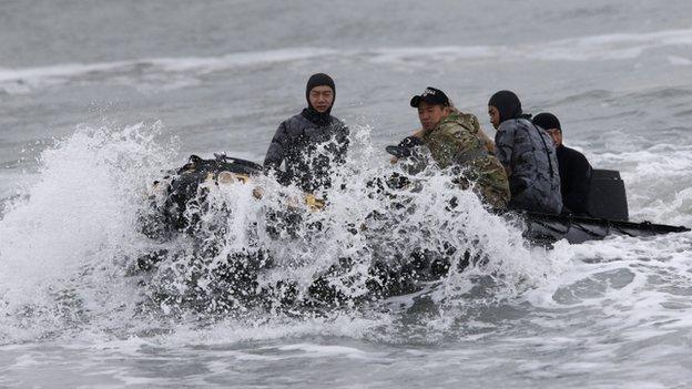 Rescue workers head towards sunken South Korean passenger ship "Sewol" during a rescue operation in the sea off Jindo April 17, 2014.