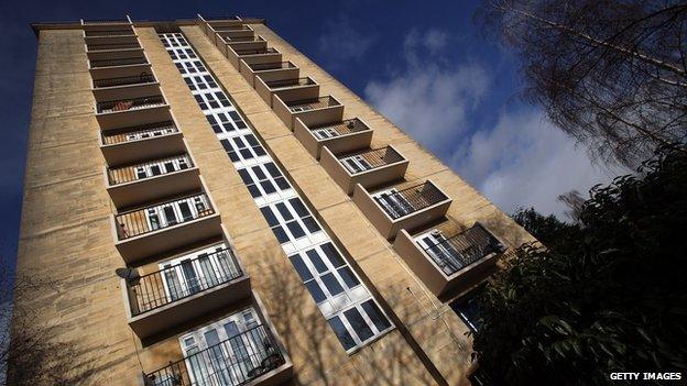 The sun reflects on windows in a block of flats on 2 January 2012 in Bath, England.