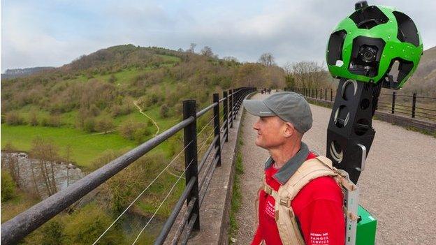 Peak District National Park Ranger with Google Trekker backpack on the Monsal Viaduct, Peak District