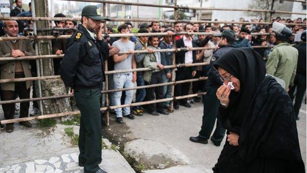 Samereh Alinejad cries after she spared the life of her son's convicted murderer with an emotional slap in the face as he awaited execution with the noose around his neck in the northern city of Nowshahr on April 15, 2014