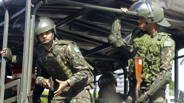 Soldiers patrol the city centre during a police strike in Salvador, Bahia state, April 17, 2014