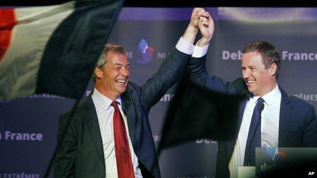 Nicolas Dupont-Aignan, right, cheers UK Independence Party (UKIP) leader Nigel Farage, left