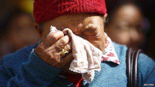 The mother of Kaji Sherpa cries as she waits for the body of her son to arrive in Kathmandu - 19 April 2014