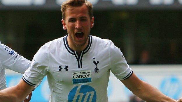 Tottenham striker Harry Kane (second right) celebrates his side's second goal against Fulham