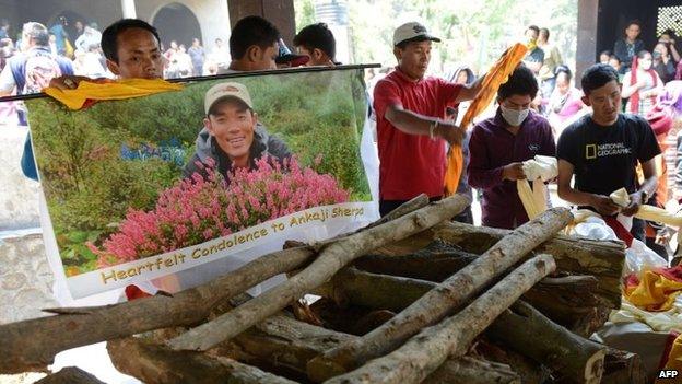 Relatives prepare for the cremation of a Mount Everest avalanche victim in Kathmandu