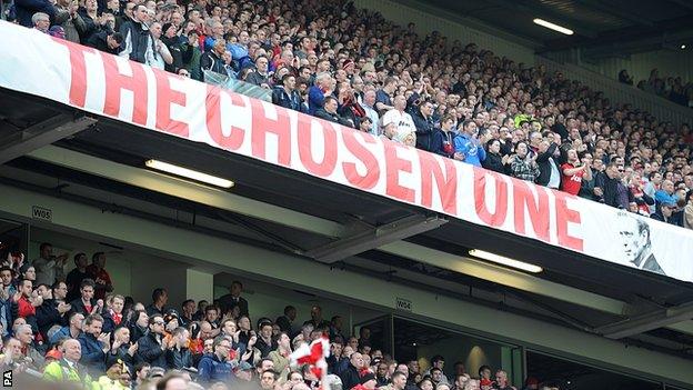 Manchester United fans at Old Trafford next to the David Moyes 'The Chosen One' banner