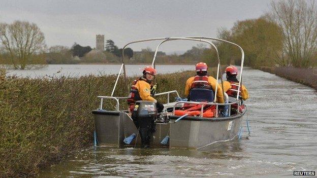 Boat operated by emergency services heading toward Muchelney