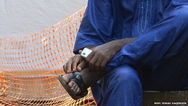 An Ebola survivor sitting down