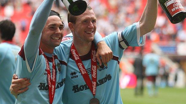 Steven Caldwell (right) celebrates Burnley's promotion in 2009