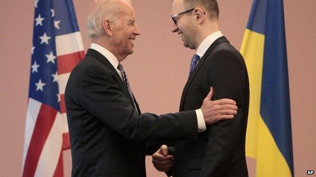 Joe Biden, left, talks to Ukrainian Prime Minister Arseniy Yatsenyuk during a meeting in Kiev, April. 22