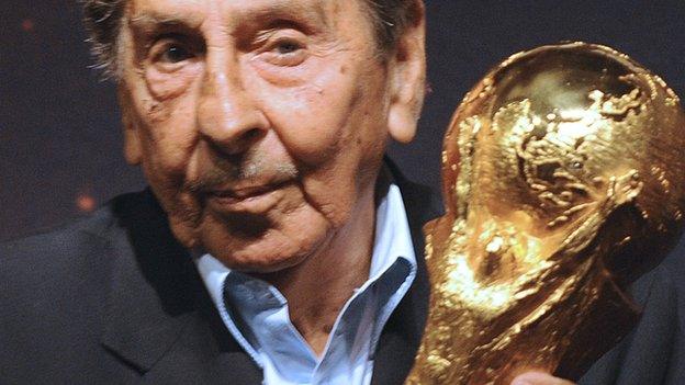 Alcides Ghiggia pictured with the World Cup before the draw for the 2014 tournament