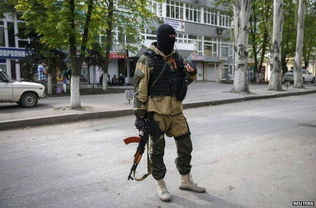 A masked pro-Russian gunman in Sloviansk, eastern Ukraine, 23 April