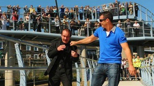 Enzo and Joe Calzaghe on the bridge named after them in Newbridge