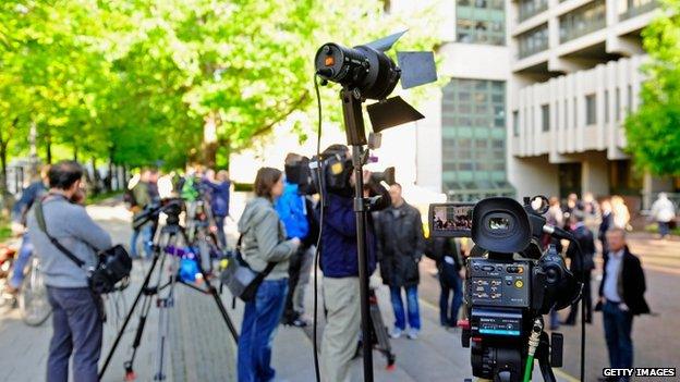 News media await the arrival of Bernie Ecclestone outside the Munich court